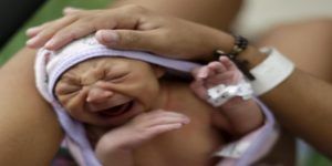 Sueli Maria holds her daughter Milena, who has microcephaly, at a hospital in Recife