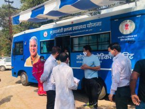 Vikas Upadhyay arrived in the slum settlements driving the hospital cum laboratory bus this morning